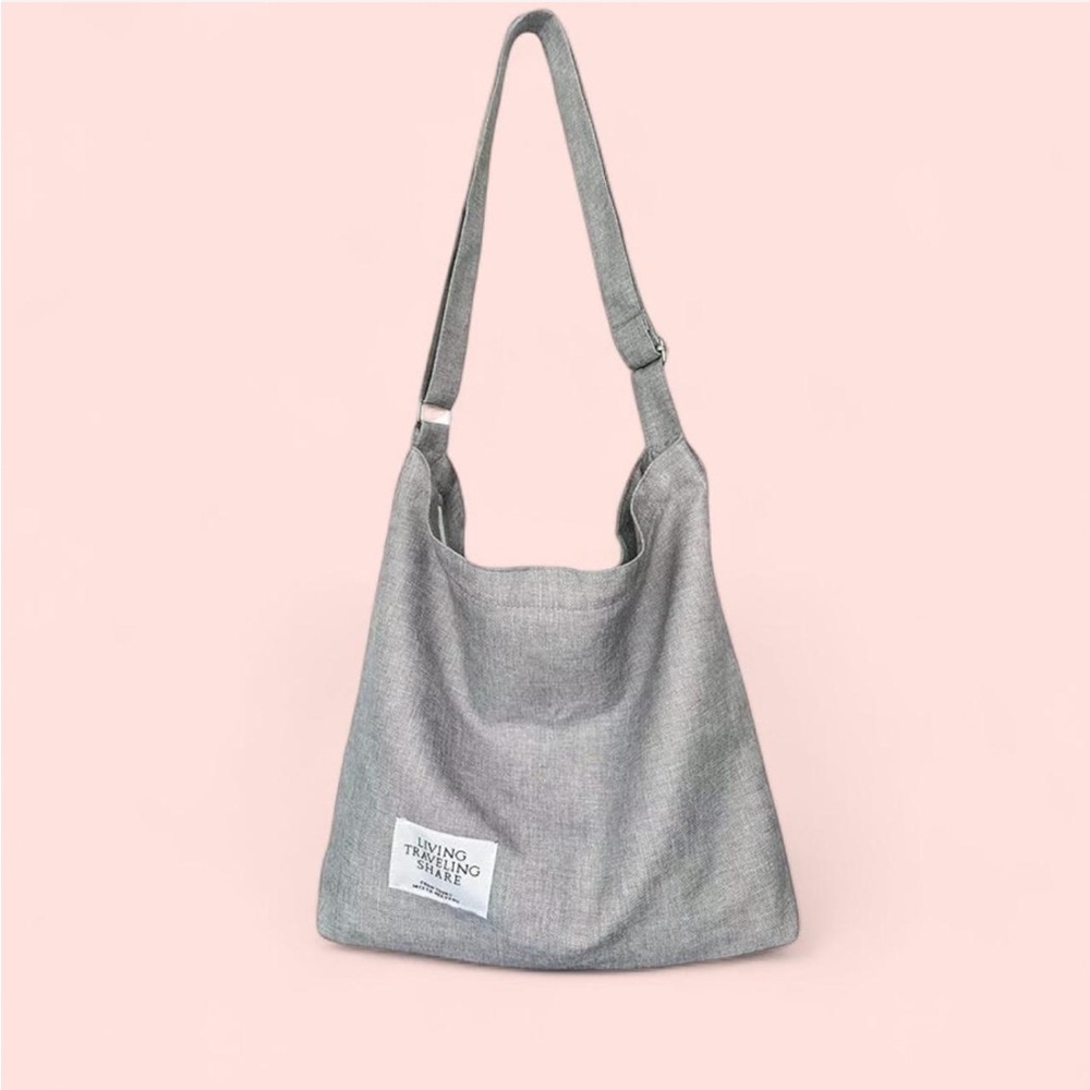 Grey canvas shoulder tote bag with adjustable straps
